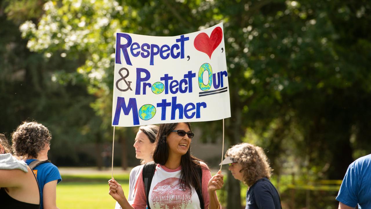 Image of student at climate strike on UC Davis campus.