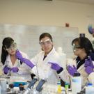 Students in labcoats and goggles